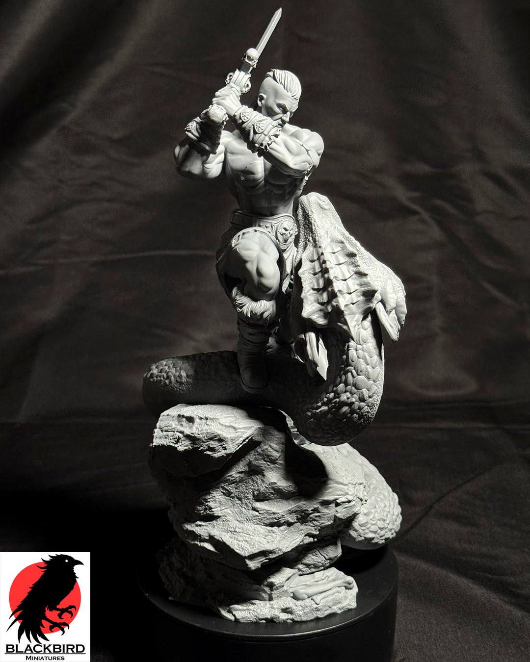 The Sword and the Basilisk 3D printed resin display figurine by Black Bird Miniatures depicting a barbarian warrior battling a giant serpent